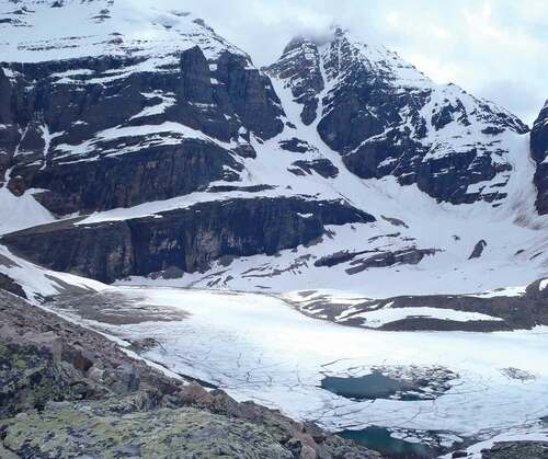 Figure 5. Photo of Lake Oesa on 2 July 2012 showing avalanche debris on ice surface below Abbott Pass. Photo was taken by MHO