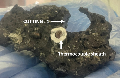 Figure 15. View of VF-U1 metallic bock after cutting with ⊘15 mm tool (core bore has broken out of the block).