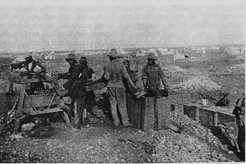 Figure 3. Black workers using a sieve on the Lichtenburg diggings. (Source: T.P. Clynick ‘“Digging a Way into the Working Class”: Unemployment and Consciousness Amongst the Afrikaner Poor on the Lichtenburg Alluvial Diamond Diggings, 1926–1929’, in R. Morrell (ed.), White but Poor: Essays on the History of Poor Whites in Southern Africa 1880–1940 [Pretoria, University of South Africa, 1992].)