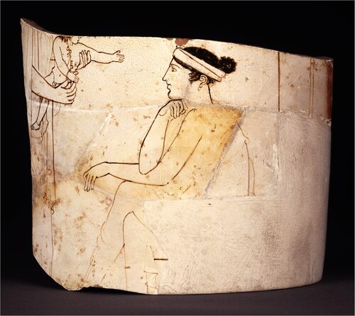 Figure 7. Athenian white-ground lekythos fragment, showing an infant reaching out to a woman seated on a grave marker. British Museum, London GR1905.7-10.10. © Trustees of the British Museum, London.