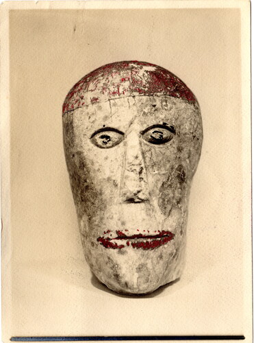 Figure 3. Thomas Arthur Bennett, Hand-colored print of painted stone head thought by Bowes to be of Roman date, 1928, (Bowes scrapbook 1, p195, HBHRS archive, digital scan by Pete Knowles).
