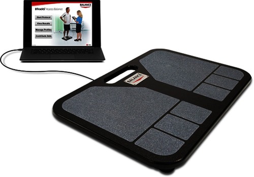 Figure 1 Testing materials for this study included the BTrackS Balance Plate (right) and BTrackS Assess Balance software running on a laptop (left). Abbreviation: BTrackS, Balance Tracking System.