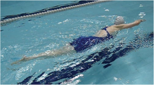 Figure 3. Pum enjoying moving her body through the supportive medium of water, which offers routines of sensorimotor integration and progress in movement for psychological integration and health.
