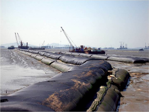 Figure 19. Geotextile tubes hyraulically filled with sand as reclamation dike unit. Source: [Citation60].