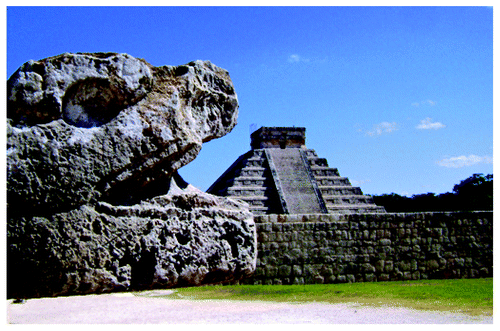 Figure 2. Archeological site of Chichen-Itza visited by the meeting participants. Kukulkan pyramid (back) and head of feathered snake (front)