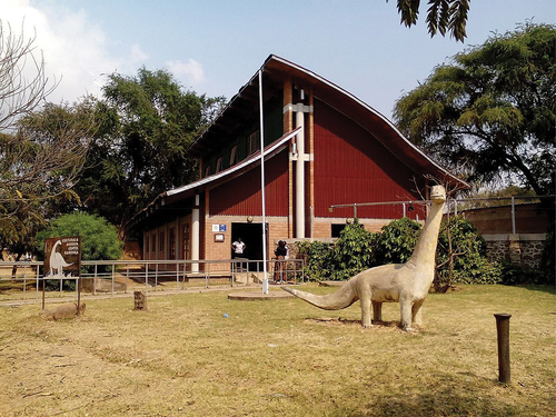 Figure 1. The Cultural and Museum Center Karonga in a shape of dinosaur and a sculpted dinosaur in front. Source- Cultural and Museum Center Karonga.
