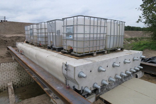 Figure 19. In situ testing of the bridge with water-filled containers.