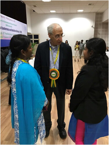 Figure 4. Dr. Coleman mentoring students at a radiobiology meeting in Chennai, India in 2016.Source: Jeffrey Buchsbaum.