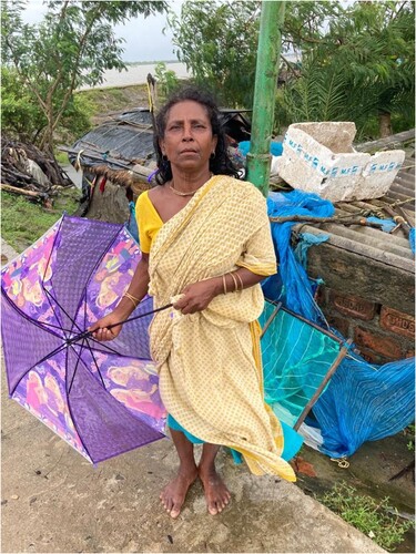 Figure 5. Sarati Katwa a displaced elderly in front her hut emplaced (relocated) by embankment erosion. Her son workers in Tamil Nadu, while she lives with her grandchildren as caregiver. (Debojyoti Das).