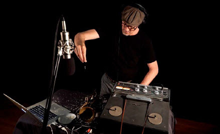 Figure 1. Still from Peter Knight – Solo for Trumpet, Delays, Tape and Rice (2019). Knight’s performances shift assumptions about the sources of sound and approaches to tone production, and combine as created on the trumpet and laptop with mechanical tape decks, delays and rice. See Australian Art Orchestra (Citation2019b). Video production Leo Dale
