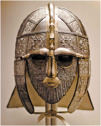 Figure 7. A recreation of the Sutton Hoo ceremonial helmet (500–700 AD). Notice how, like the above Vendel helmet, the dual weapon dancing Odin foil is featured prominently on the front of the helmet, meant to be seen by the viewer. This once again reinforces the idea that Iron Age elite wanted to emphasize this relief, and possibly the social values connected with it, in a ceremonial setting (Ramsay 2017)