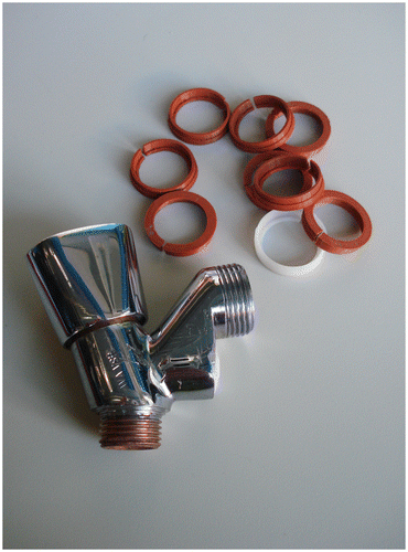 Figure 3 Boy’s ‘restored’ tap and several 3D-printed washers self-manufactured at the FabLab Utrecht.