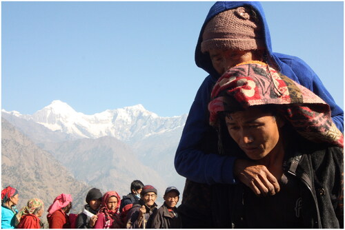 Figure 3. A Tamang woman is being carried to a health camp by her son. Nursing cases depend on the availability of eligible persons to fulfil care functions. Verbal consent obtained. Picture: By author.