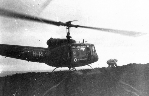 Figure 5. Landing on Tvistein Pillars and collection of rock samples on 3 March 1971 at 11:00. The helicopter is a Bell UH-1H Huey from the 7th Brigade of the Argentine Air Force. (DNA-IAA Archive of Historical Photography, AFH000457.)