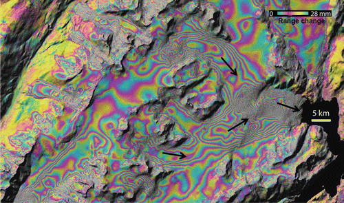 Figure 4. Movement of glaciers over Kenai Pennisula, southern Alaska in 24 hours between 12 and 13 November 1995. The interferometric phase image is draped over the radar intensity image. Each fringe (full-color cycle) represents a 2.8-cm change in range distance.