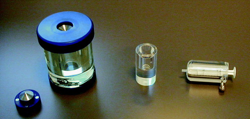 Figure 3.  Example of shielding. Left to right: Vial shielding made of perspex surrounded by lead glass, mini-vial shielding made of perspex, and syringe shielding made of perspex.