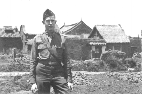 Figure 6. A photograph of Bill Evitt standing immediately outside a village near Kunming in Yunnan Province, southern China, during his posting there in World War II. The image is reproduced with the approval of the Evitt family.