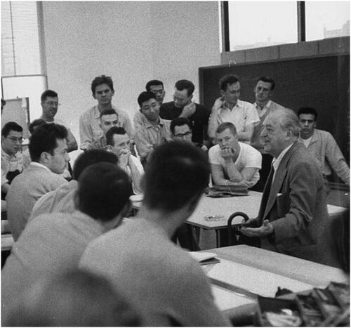 Figure 6 Ludwig Mies van der Rohe with his students at IIT discussing some problems they have come up in their individual projects. While emphasizing fundamental principles of architecture, he reminds them that “God is in the details.” Photograph taken by Frank Scherschel on 1 November 1956. Credit: Getty Images.