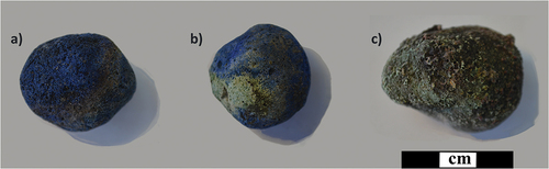 Fig. 3. Three rounded Egyptian blue pellets from the Koan workshop, representing a) a successfully produced pellet (blue); b) a partially successful pellet (presenting both green and blue areas on the surface); c) an unsuccessfully produced pellet (no blue observable on the surface of the find). Photos: author, with permission of the Ephorate of Antiquities of the Dodecanese.