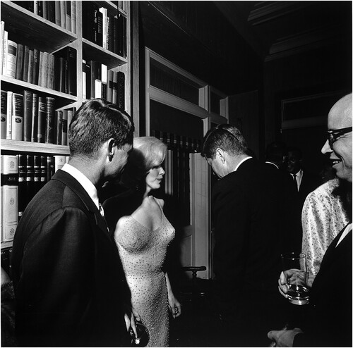 Figure 2. Monroe with Robert F. Kennedy and John F. Kennedy after the gala at Madison Square Garden. Photo by Cecil W. Stoughton, from Wikimedia Commons.