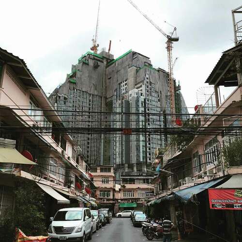 Figure 2. Rows of shophouses juxtaposed with a high-rise residential condominium in Bangkok