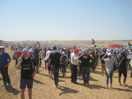 Figure 1. People marching towards the event site of 2016 March of Return. Photo by the author.