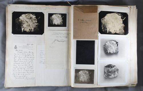 Figure 4. Bowes’ scrapbook 3 containing Thomas Arthur Bennett’s photographs of the Cissbury Stone, letters from Reginald Smith and Henri Brieul and envelopes containing X-rays, letters, and more Bennett photographs, 1932 (Bowes scrapbook 3, p70–1, HBHRS archive, digital photograph by Pete Knowles).