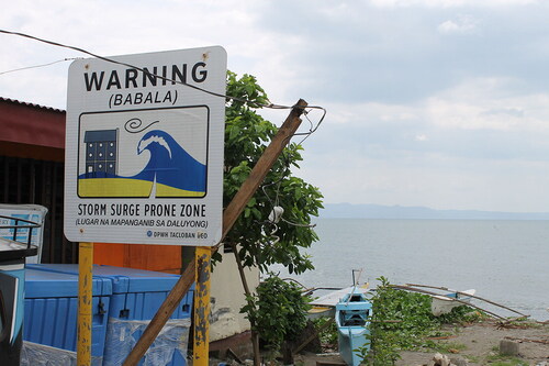 Figure 3. Storm surge warning sign in the danger zone. Image by a PhotoKwento participant, used with permission.