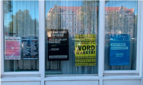 Figure 4. Another way of demonstrating affiliation with the movement is through posters: this window displays statements like ‘Never forget: no farmers, no food!’, ‘Wake up!’, ‘Vaccinated? Unvaccinated? Human’. Photographed by first author on 19 October 2022.