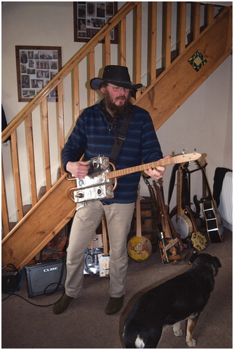 Figure 5 Woofie’s “steampunk” tin guitar made from whiskey tins and copper tubing.