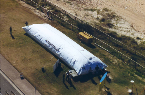 Figure 23. Mega sand container with a by then unprecedented size of 20 m (length) × 4.80 m (diameter) as presented in 1999 on an open day for the public at the construction site [Citation39, Citation40].