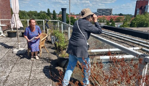 Figure 5. Afke as ‘neighborhood watch’ on her rooftop garden.