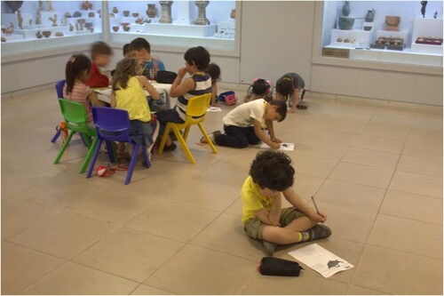 Figure 9. Children using on-gallery education resources inside Fethiye Museum. (Photo credit: Gülşen Yegen for FETAV).