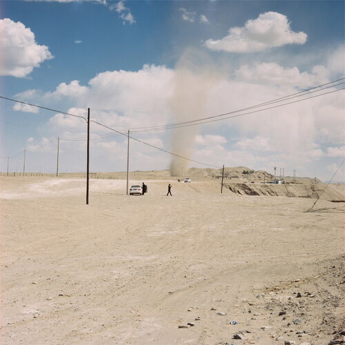 Figure 1. A small sand tornado on the deserted ground. Hotan, March 2017.