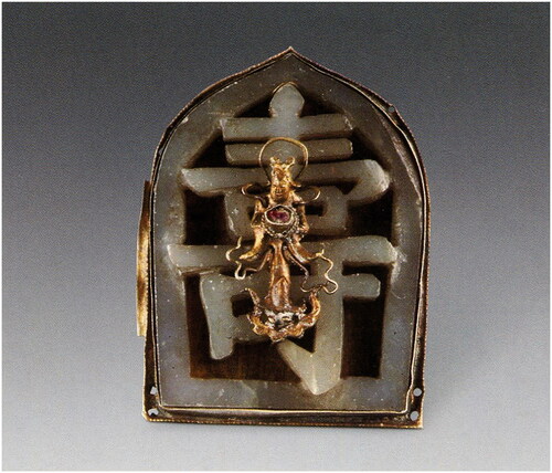 Figure 5 A headwear made of gold and jade carved with the Chinese character for “longevity,” about the middle and late sixteenth century. Unearthed from the tomb of Lu Shen family in Shanghai in Ming Dynasty. Ming Tombs in Shanghai. Beijing: Cultural Relics Publishing House.