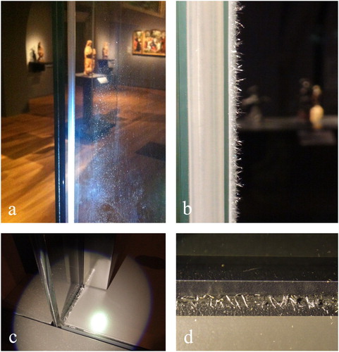 Figure 1. (a) Deposit of crystals on the window glass of a freestanding display case with hinged door and transparent silicone door gasket. (b) Close-up of crystals on silicone door gasket. (c) Long white crystals in the bottom corner of a wall-mounted display case with medium-density fibreboard (MDF-WJ) back panel, deposited on the black seals of structural adhesive Terostat-9220. (d) Close-up of crystals on the black adhesive seal. Crystals in a and b were identified as type K1, in c and d as type K2.