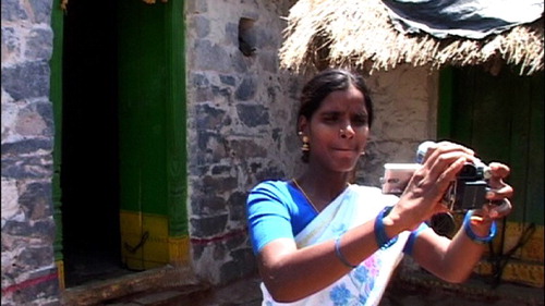 Figure 4. Vinodha filming herself outside her house.