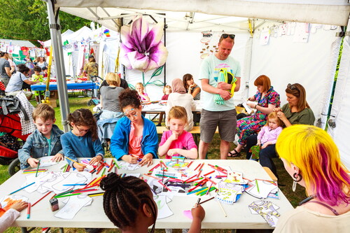 Figure 5 “Forest Fashion Stories” workshops delivered at the Walthamstow Garden Party. Photograph by Adam Razvi.