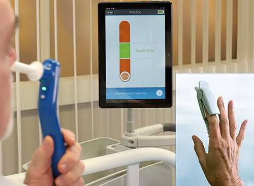 Figure 2 Indicor device. The user holds a hand piece with a disposable mouthpiece filter connected to an expiratory pressure sensor. A photoplethysmography (PPG) probe connected to the hand piece is placed on a finger of the other hand. The expiratory pressure and PPG signals are wirelessly input into the tablet, which automatically guides the user through a 10-second Valsalva maneuver at 20 mmHg effort, and then calculates the Valsalva Pulse Response (VPR).