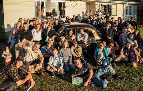 Figure 2. On-set cast and crew photograph (23 November 2020). People in this image constituted less than half of the 32 scripted actors, 171 production and postproduction crew, and 127 extras involved in the production.