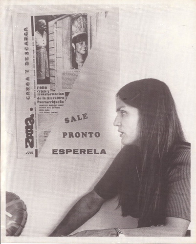 Rosario Ferré beneath poster for Zona de carga y descarga, circa 1972. Courtesy of Benigno Trigo.