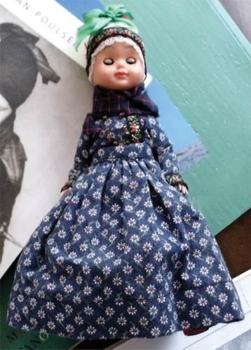 Figure 2. Doll wearing folklore costume. Brought to interview by Gitte.