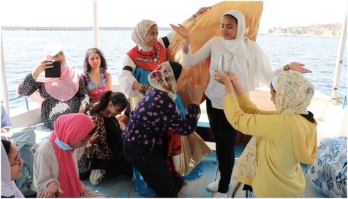 Figure 5. Participants performing on the boat. Photo by Gamal Megly.