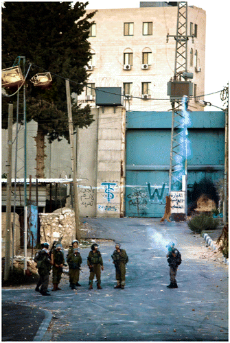 Figure 1. An IDF patrol firing a tear gas towards protesters, Aida refugee camp, Bethlehem (Photo: Guglielmo Chelazzi Grandinetti).
