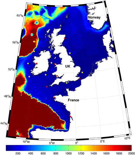 Figure 1. The computational domain used for the coupled tide-wave model. The colour scale (refer to the web version) represents the bathymetry in metres, and the filled circles show the location of validation points (red represents a tidal, and yellow represents a wave point).