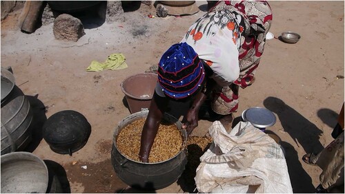 Figure 12. Woman processing (soaking and parboiling) rice in Duko, Northern Region, Ghana.