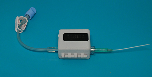 Figure 3 Device secured around infusion tubing.