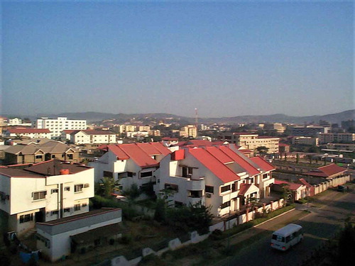 Figure 4. Abuja: housing below the protected surrounding hills, illustrating both the planning goal of fitting the city into the landscape and domestic buildings that may not be ideal for the African environment (photo Ian Douglas)