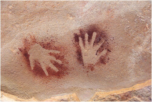 Figure 1. Two hand stencils made at Liwingkinya (Vanderlin Island) by the namurlanjanyngku spirit beings on the morning the research team arrived (photograph: Liam M. Brady, 2019).