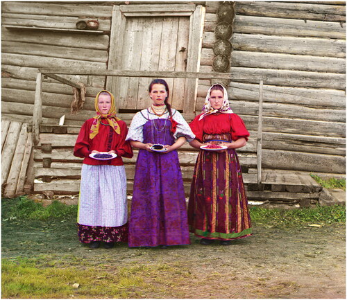 Figure 2. Young Russian peasant women in front of traditional wooden house in a rural area along the Sheksna River near the small town of Kirillov. Early colour photograph from Russia created by Sergei Mikhailovich Prokudin-Gorskii as part of his work to document the Russian Empire from 1909 to 1915. Sergei Mikhailovich Prokudin-Gorskii Collection, Library of Congress, Washington, DC. Wikimedia Commons.